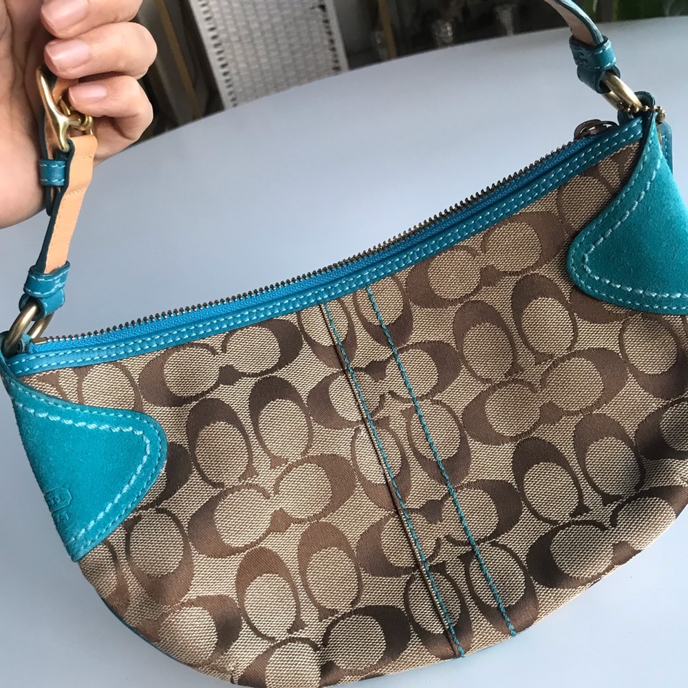 Bright blue and monogram Coach shoulder bag